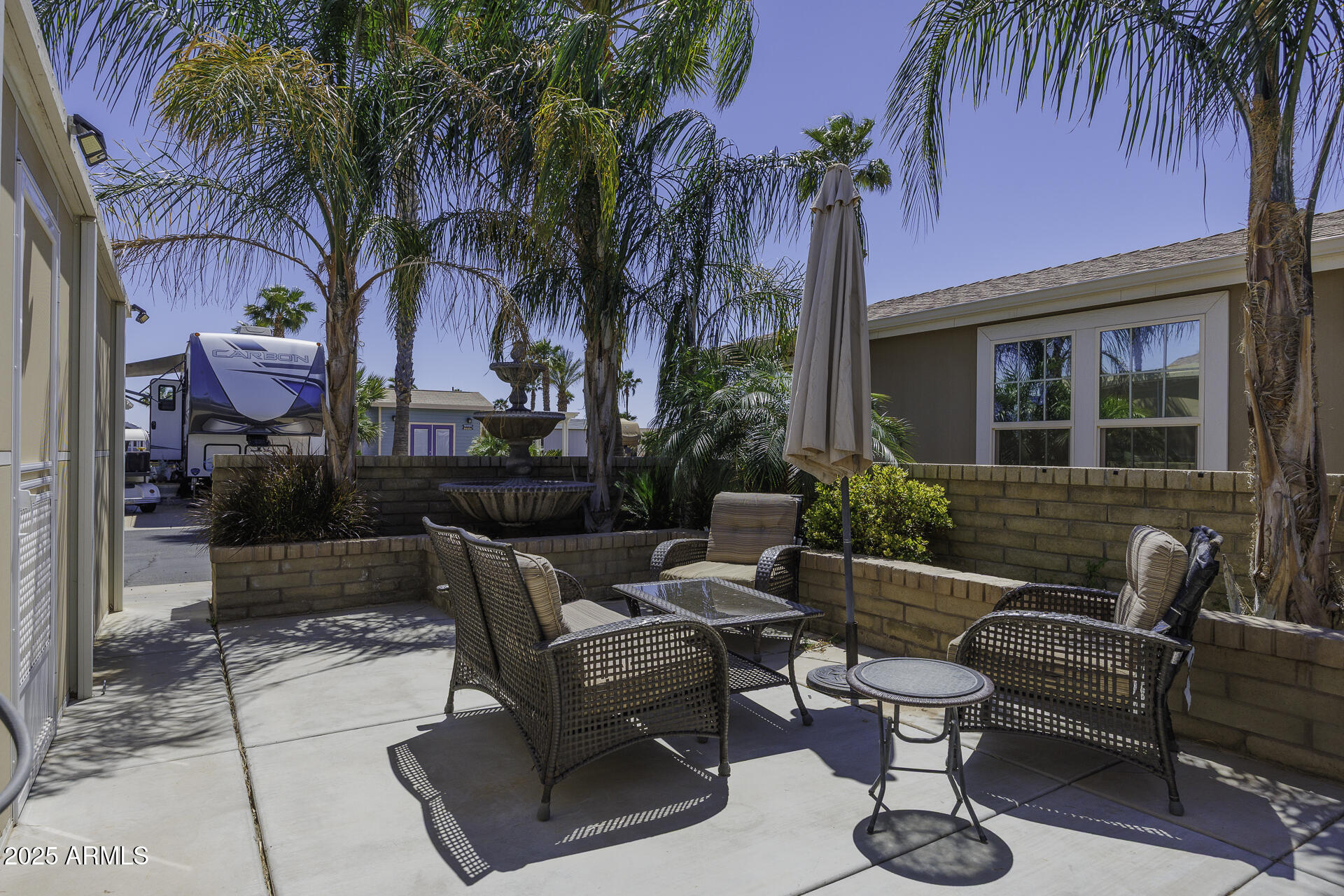1110 North Henness Road, Unit 1351 Casa Grande, AZ 85122 - Photo 3 of 62 a view of a patio with swimming pool table and chairs