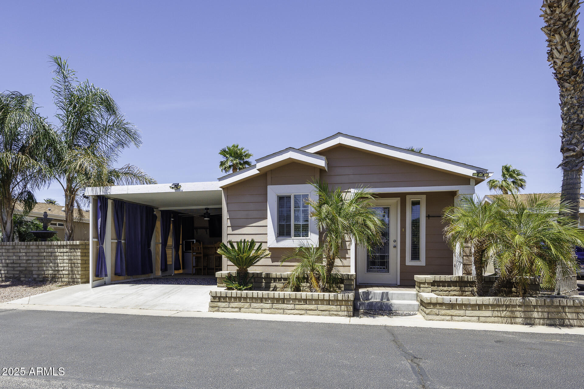 1110 North Henness Road, Unit 1351 Casa Grande, AZ 85122 - Photo 4 of 62 a front view of a house with a outdoor space