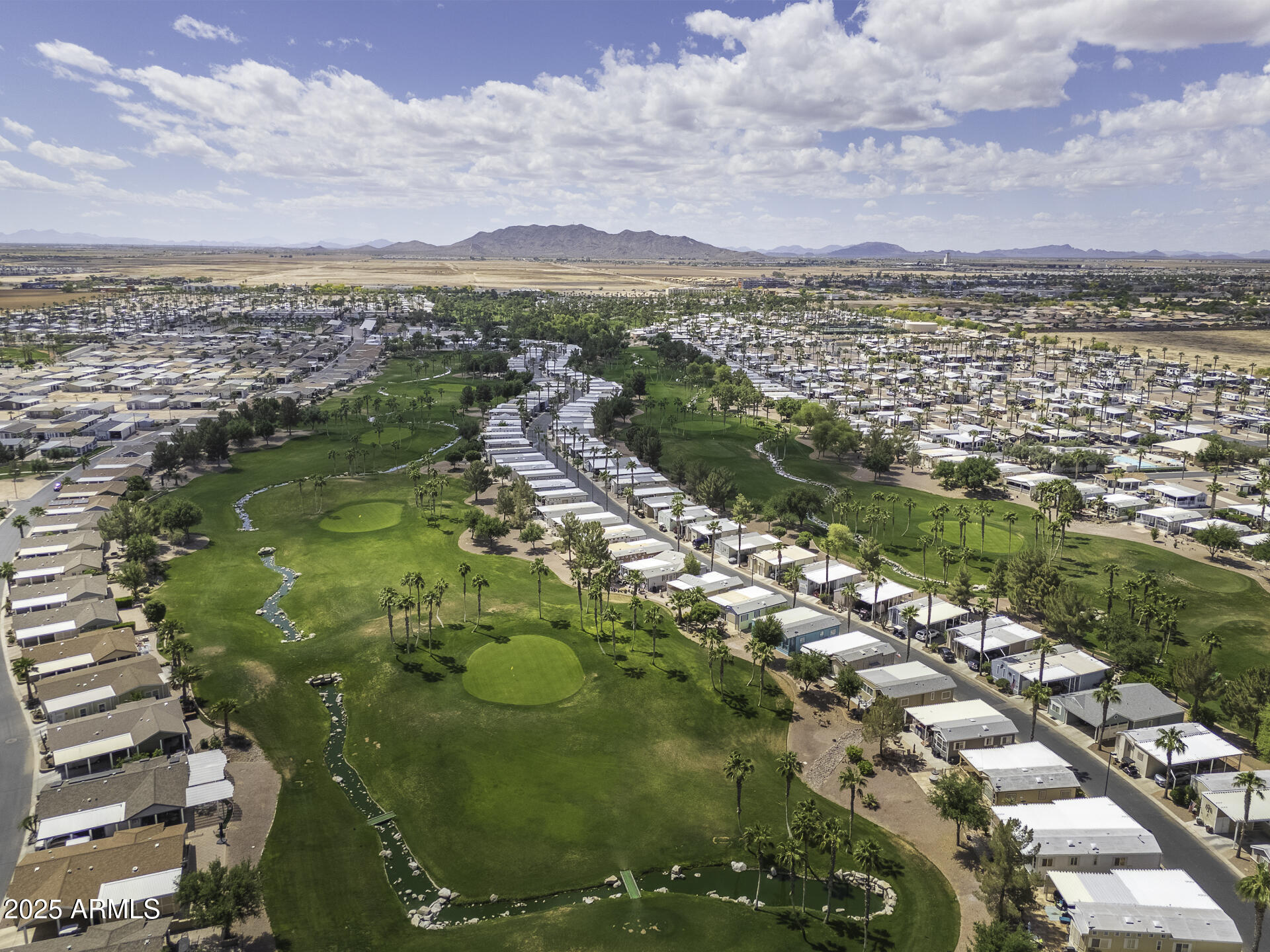 1110 North Henness Road, Unit 1351 Casa Grande, AZ 85122 - Photo 45 of 62 an aerial view of residential houses with outdoor space