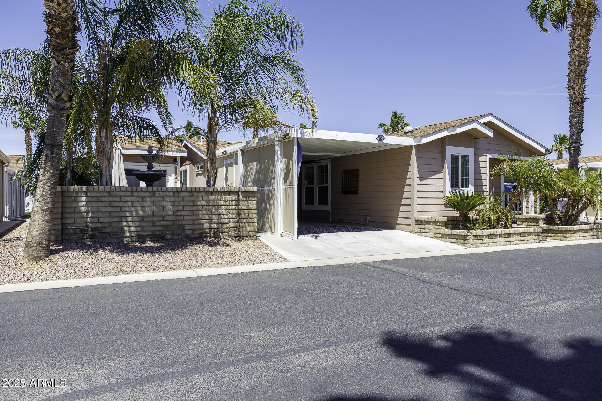 1110 North Henness Road, Unit 1351 Casa Grande, AZ 85122 - Photo 5 of 62 a front view of a house with a yard and garage