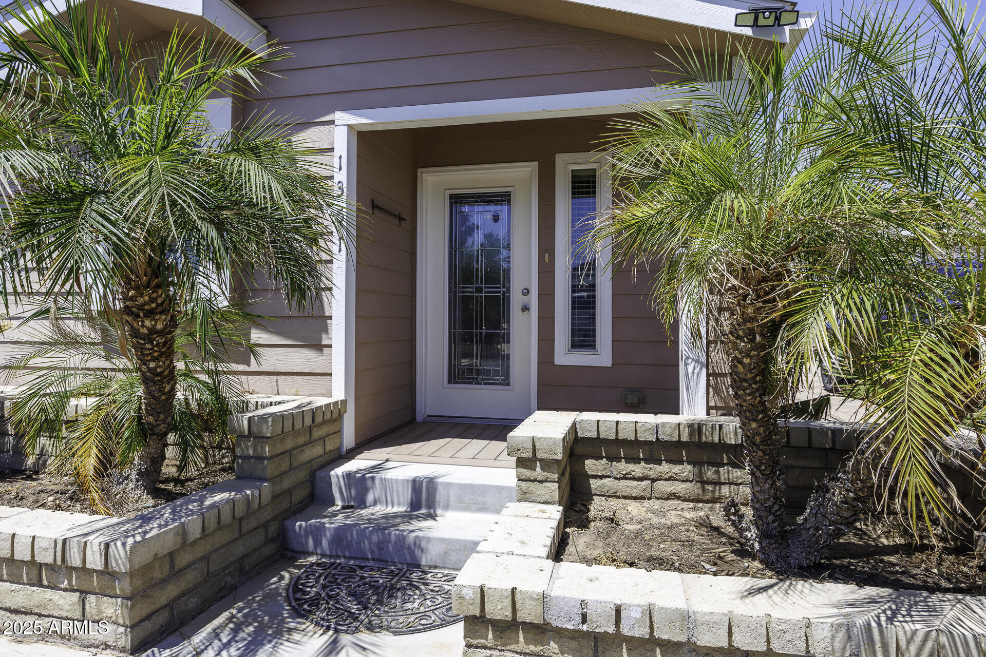 1110 North Henness Road, Unit 1351 Casa Grande, AZ 85122 - Photo 7 of 62 a view of a patio with couches table and chairs and potted plants