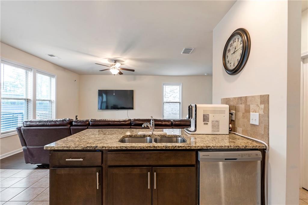 4265 Almanor Circle Norcross, GA 30071 - Photo 11 of 34 a bathroom with a granite countertop sink and a mirror