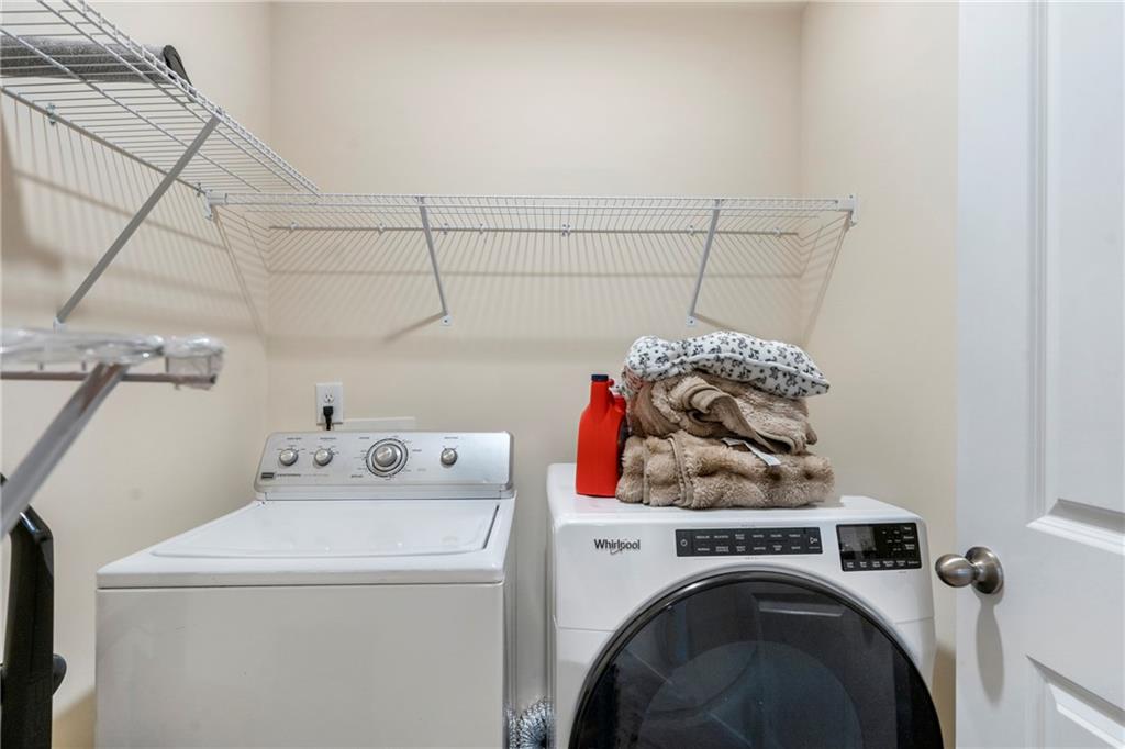 4265 Almanor Circle Norcross, GA 30071 - Photo 19 of 34 a utility room with dryer and washer