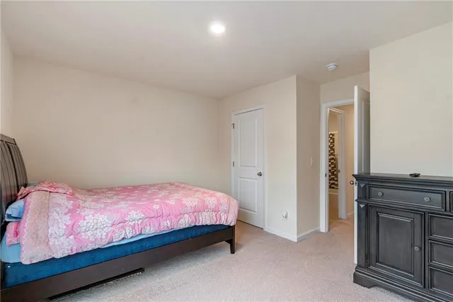 a bedroom with a bed and a fireplace