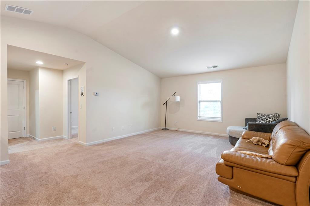 4265 Almanor Circle Norcross, GA 30071 - Photo 25 of 34 a living room with furniture and a window