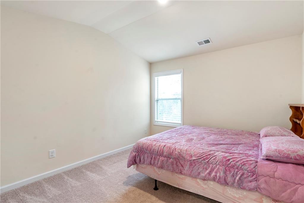 4265 Almanor Circle Norcross, GA 30071 - Photo 27 of 34 a bedroom with a bed and a window