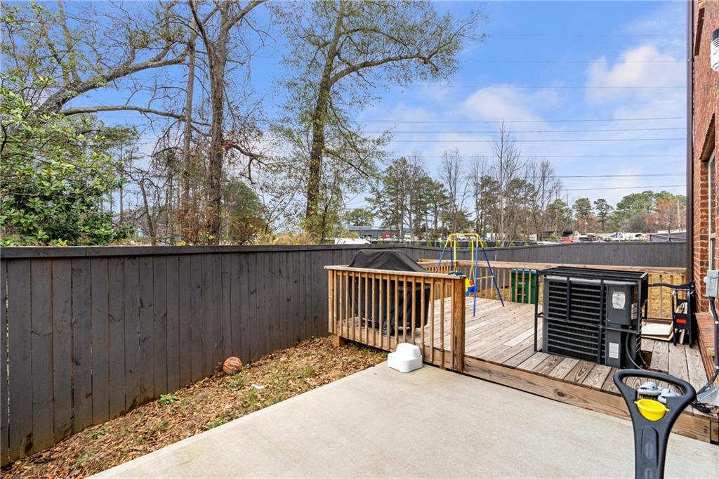 4265 Almanor Circle Norcross, GA 30071 - Photo 29 of 34 a view of roof deck with wooden fence and floor