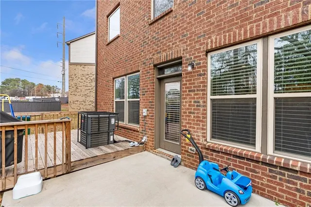 a view of a building with furniture