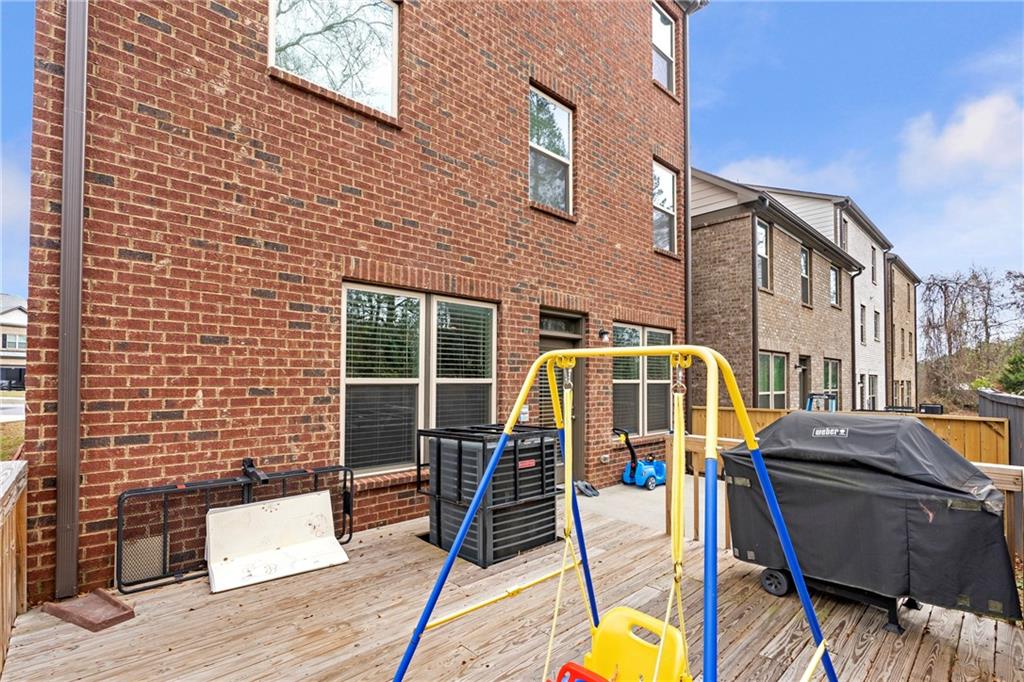 4265 Almanor Circle Norcross, GA 30071 - Photo 32 of 34 a view of a patio with a table and chairs