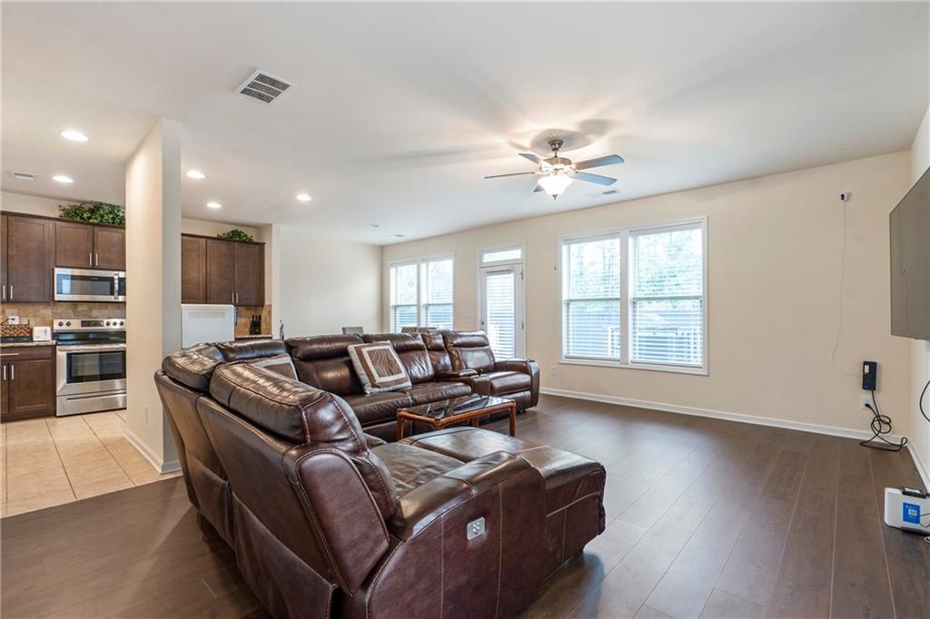 4265 Almanor Circle Norcross, GA 30071 - Photo 5 of 34 a living room with furniture and a large window