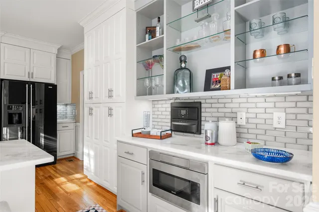a kitchen with cabinets and a stove