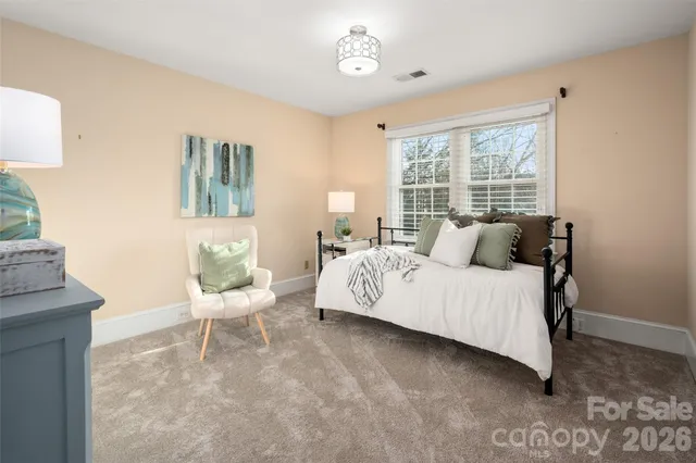 a bed room with a bed and a couch