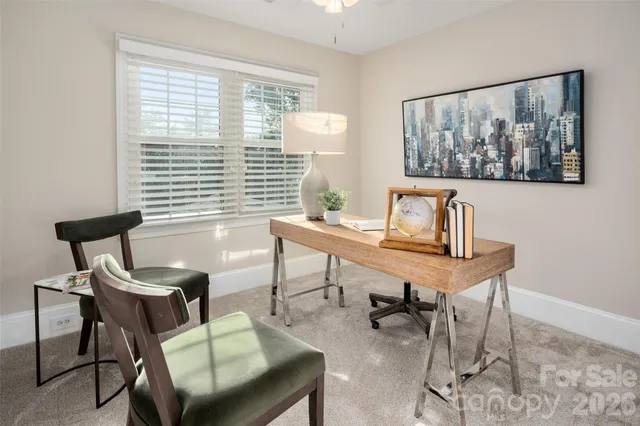 a workspace with furniture and a window