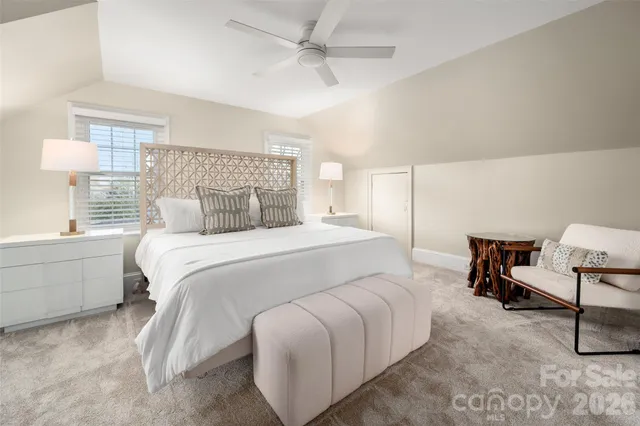 a bedroom with a bed and a chair