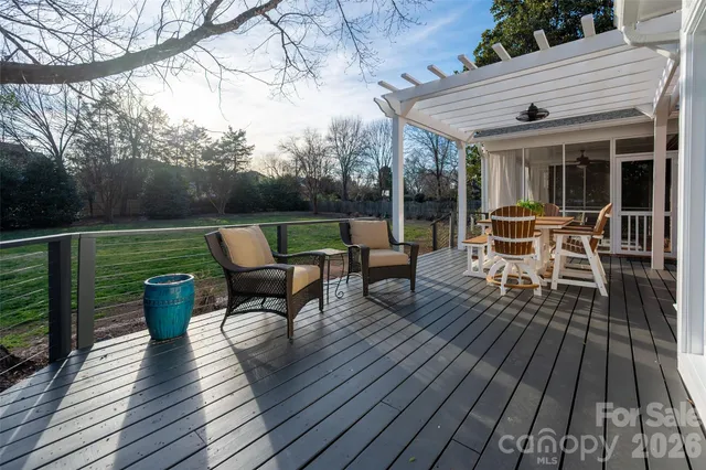 a view of a big yard with plants and trees