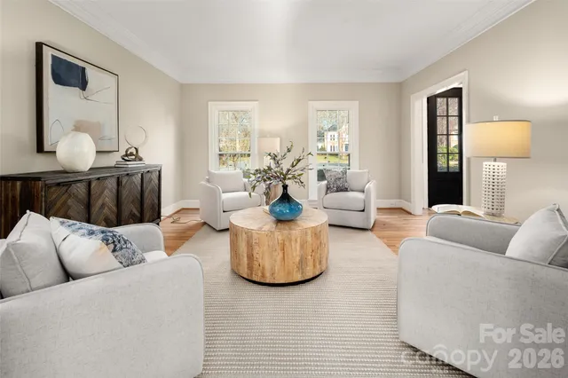 a living room with furniture and a lamp