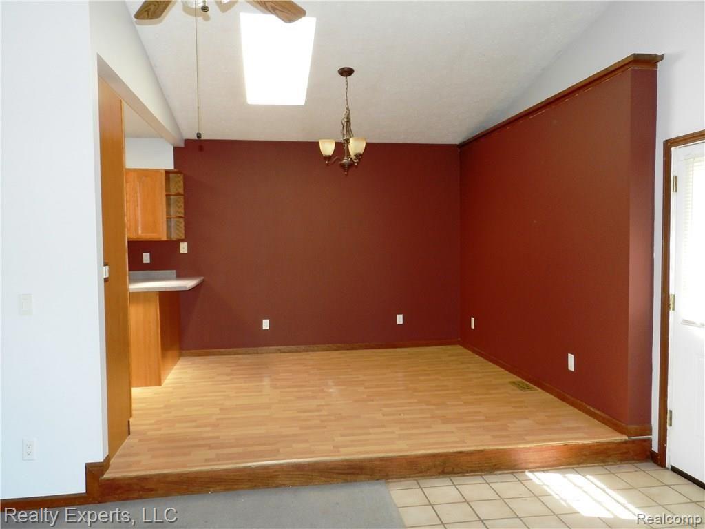 5611 Shepper Road Stockbridge, MI 49285 - Photo 7 of 18 DINING ROOM WITH SKYLIGHT