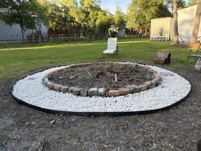 6289 South Header Canal Road Port St. Lucie, FL 34987 - Photo 36 of 52 a view of a swimming pool with green space