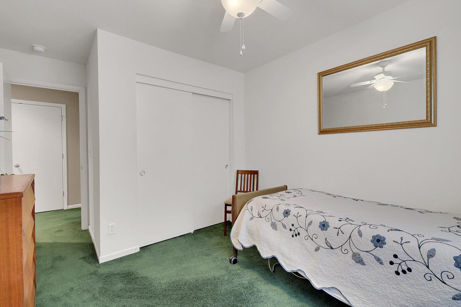 9840 Ellis Way Live Oak, CA 95953 - Photo 33 of 44 a bedroom with a bed and a painting on the wall