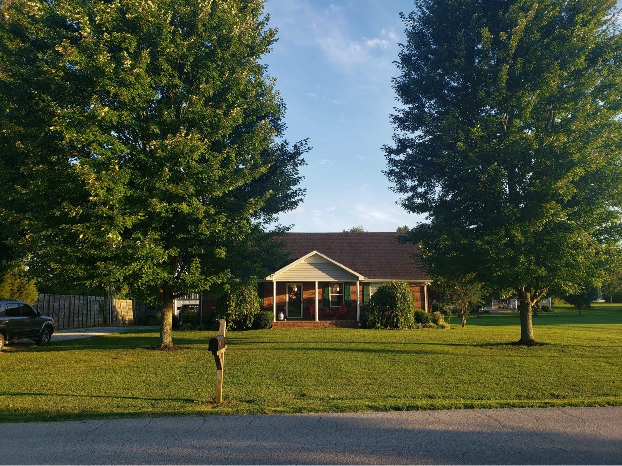 714 Days Road Lafayette, TN 37083 - Photo 1 of 19 a front view of a house with a yard