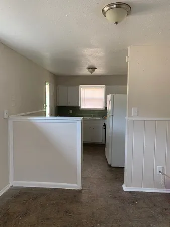 a kitchen with cabinets and stainless steel appliances