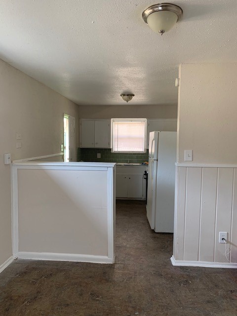 7812 Tierwester Street, Unit 120 Houston, TX 77021 - Photo 3 of 6 a kitchen with cabinets and stainless steel appliances