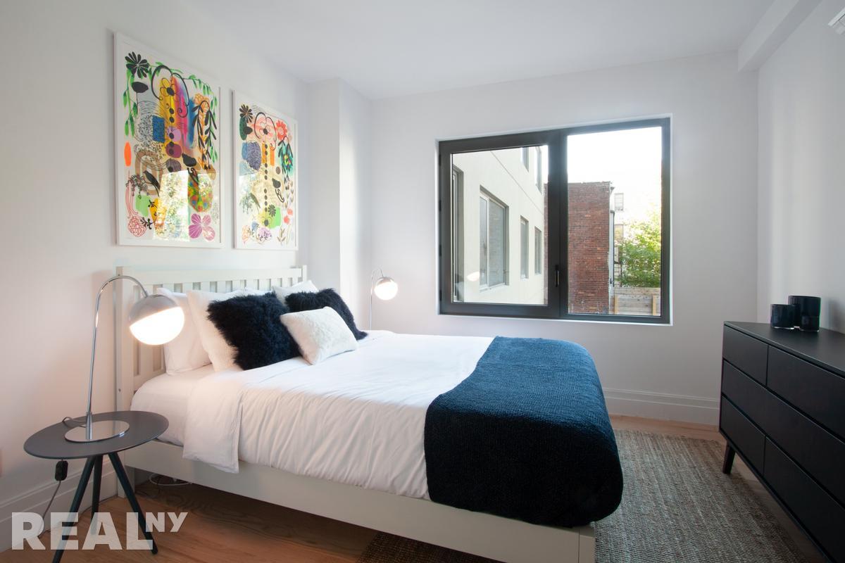 77 Clarkson Avenue, Unit 1D Brooklyn, NY 11226 - Photo 4 of 13 a bedroom with a bed and a window