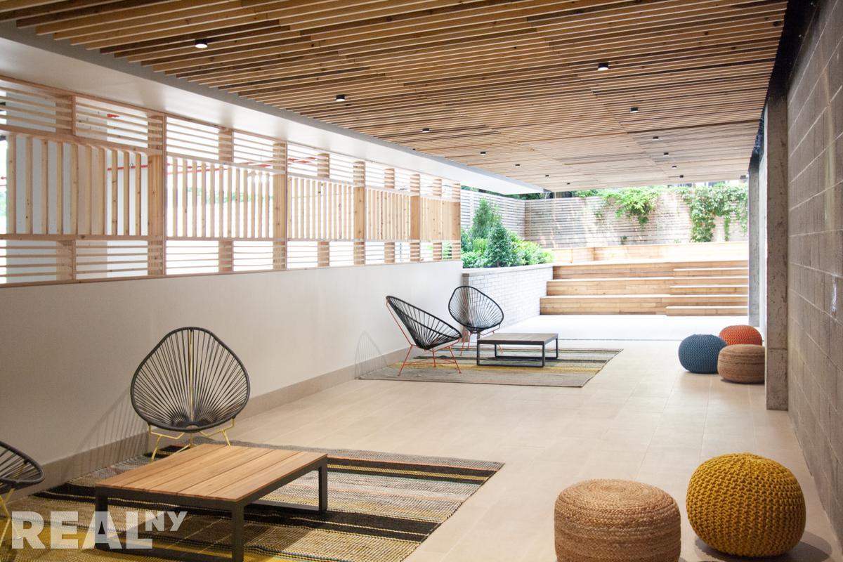 77 Clarkson Avenue, Unit 1D Brooklyn, NY 11226 - Photo 9 of 13 a living room with furniture and a large window
