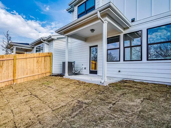 a view of a backyard of the house