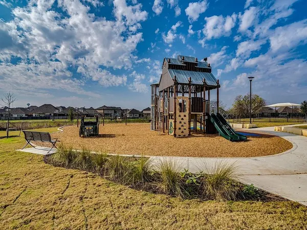 a view of swimming pool with an outdoor seating area