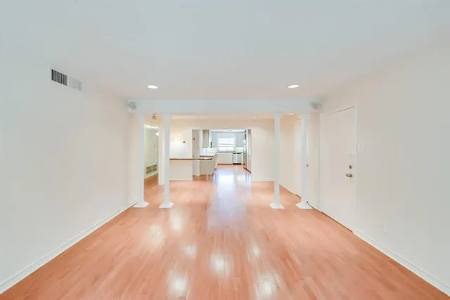 a view of a kitchen with wooden floor