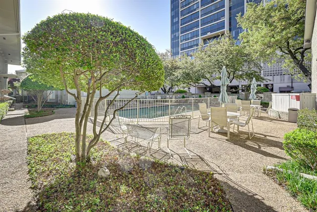 a view of a chair and tables in the patio