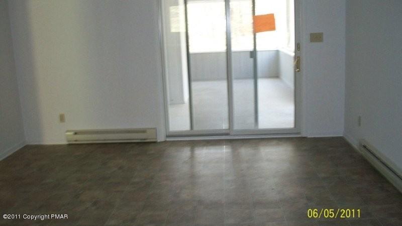 108 Lot 9) Shelbert Road Newfoundland, PA 18445 - Photo 3 of 9 an empty room with wooden floor and windows