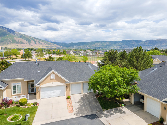 11881 Cottage View Lane Draper, UT 84020 - Photo 27 of 29 Stucco exterior with multi-pane windows and a covered front porch featuring white railing