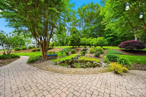a front view of a house with a yard outdoor seating and yard