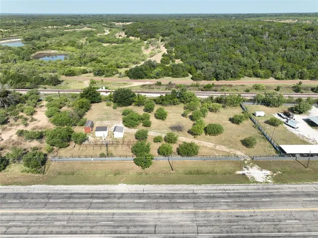 an aerial view of residential houses with outdoor space