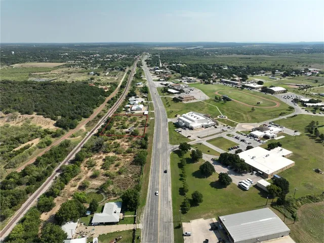 a view of a swimming pool with outdoor seating and plants