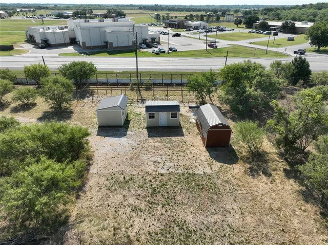 a view of a backyard with outdoor seating