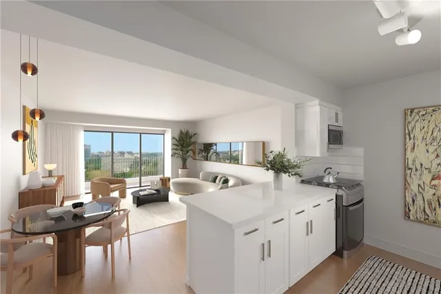 a kitchen with stainless steel appliances a sink a stove and a refrigerator