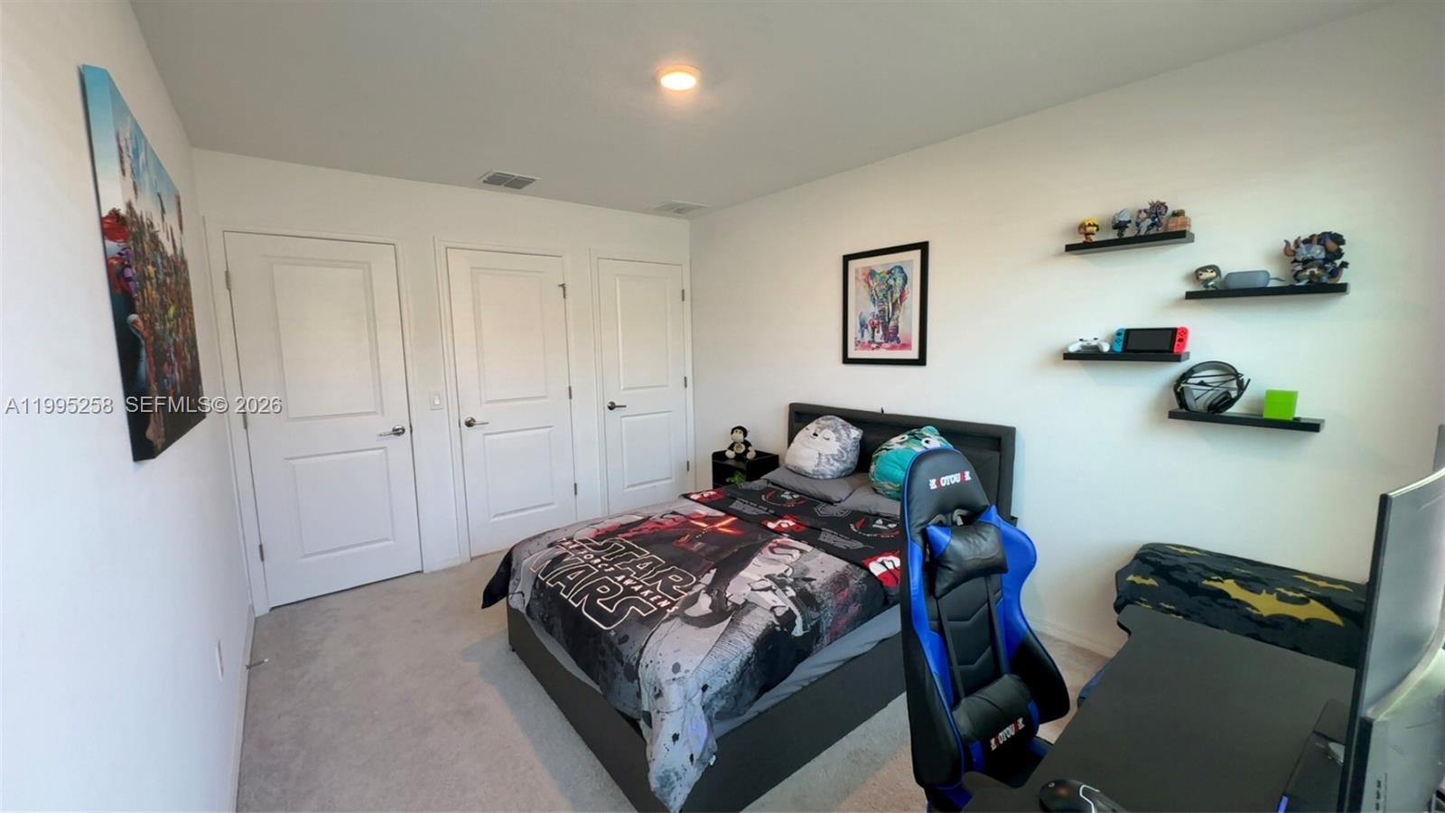 3381 Composition Street Kissimmee, FL 34758 - Photo 11 of 16 a bedroom with a bed a wall and closet