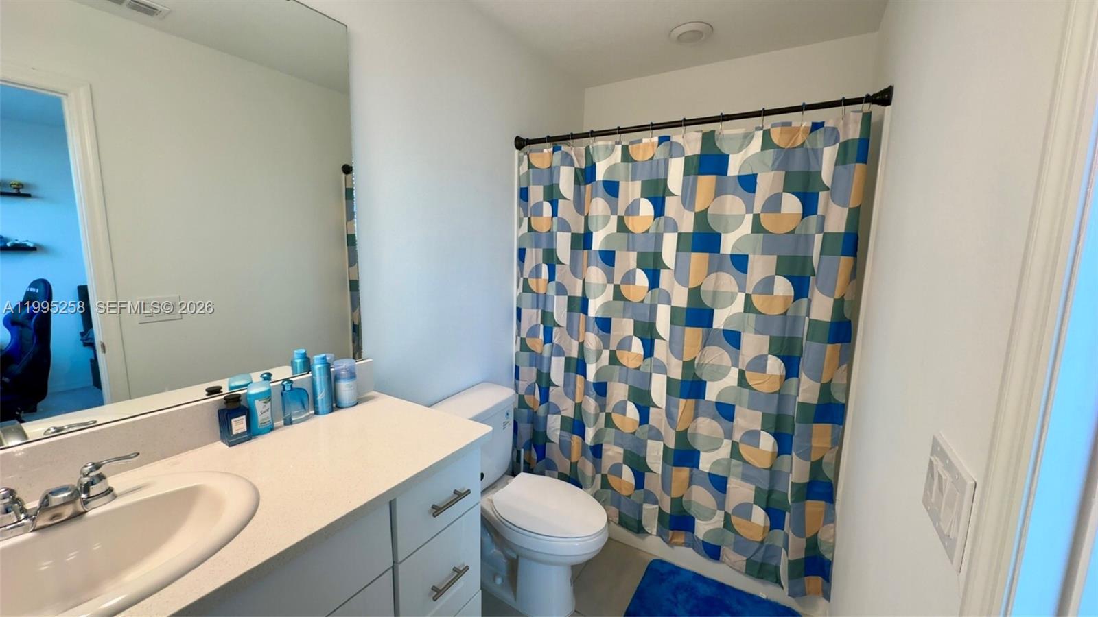 3381 Composition Street Kissimmee, FL 34758 - Photo 12 of 16 a bathroom with a sink and a toilet