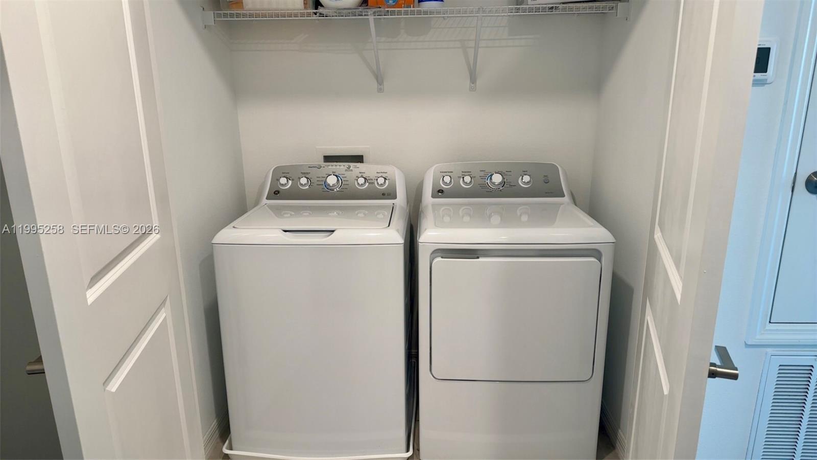 3381 Composition Street Kissimmee, FL 34758 - Photo 13 of 16 a utility room with dryer and washer