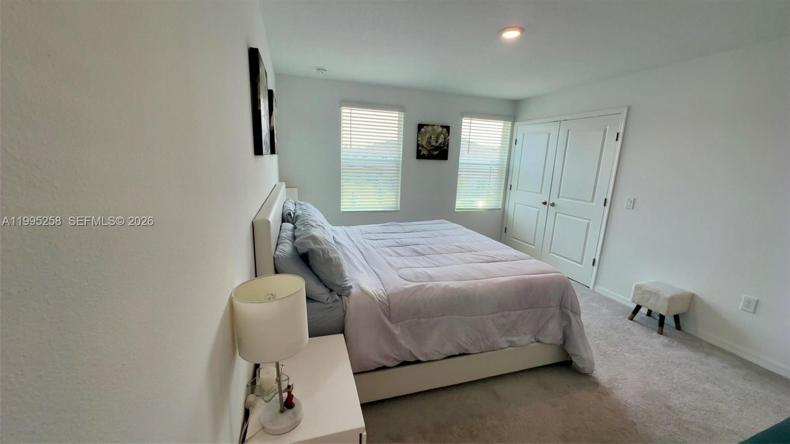3381 Composition Street Kissimmee, FL 34758 - Photo 7 of 16 a bedroom with a bed and a mirror