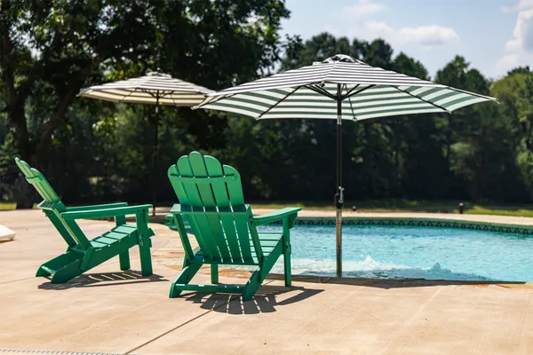 a view of a table and chairs under an umbrella