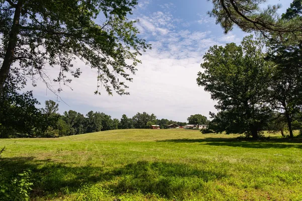 a large living room with furniture and a large window