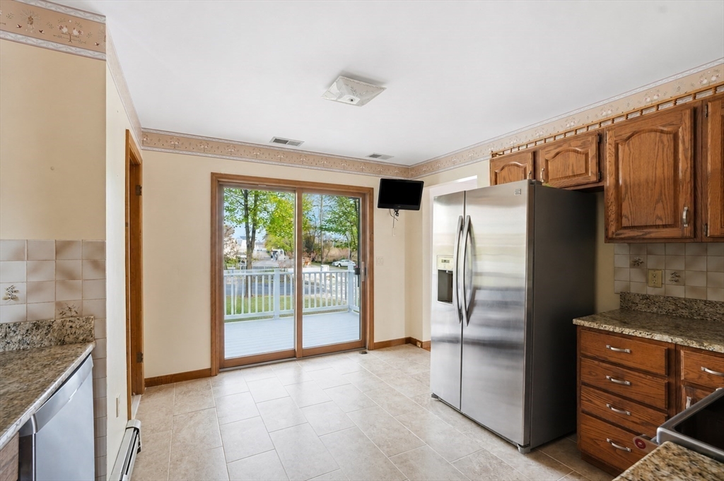 67 Wituwamat Road Weymouth, MA 02191 - Photo 10 of 42 a view of an empty room with a fireplace