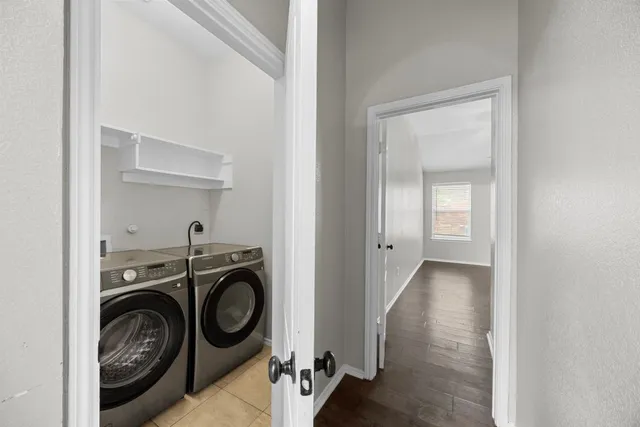 a view of storage and utility room with washer and dryer
