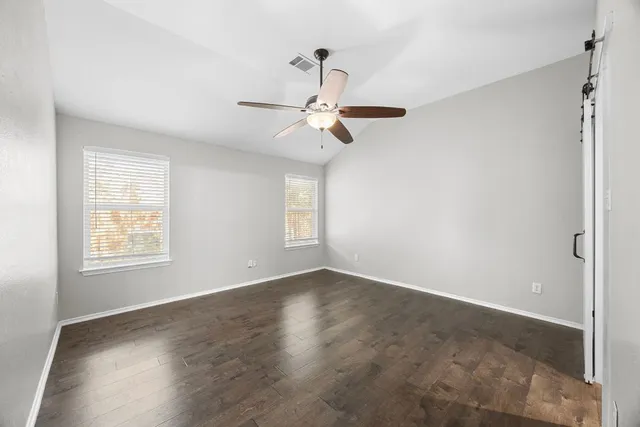 a view of an empty room with a window