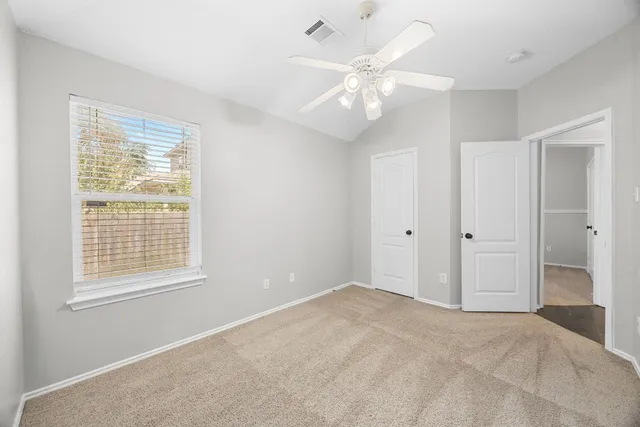 a view of an empty room with a window