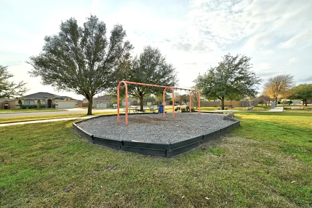 a view of a lake with a yard